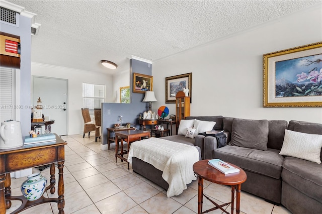 tiled living room featuring ornamental molding and a textured ceiling