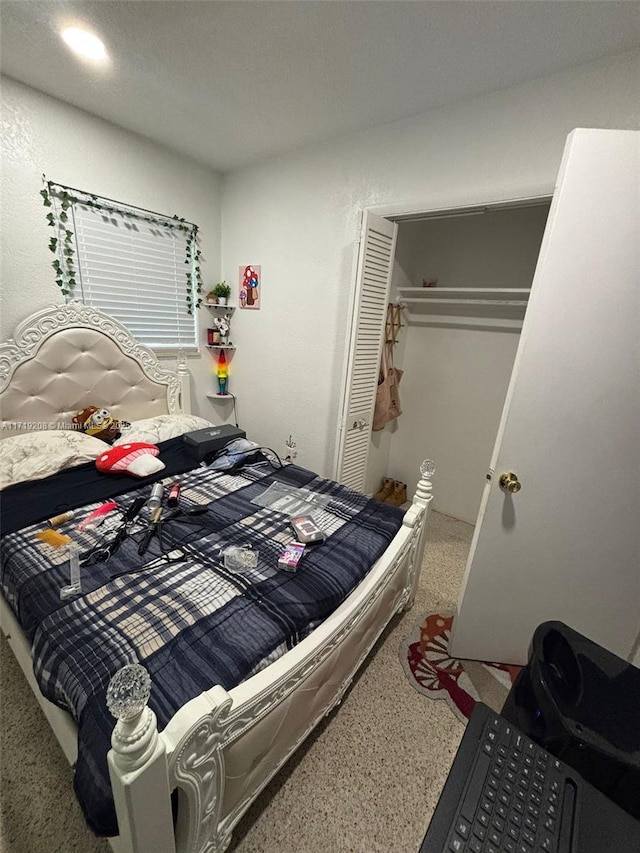 bedroom featuring a closet and speckled floor