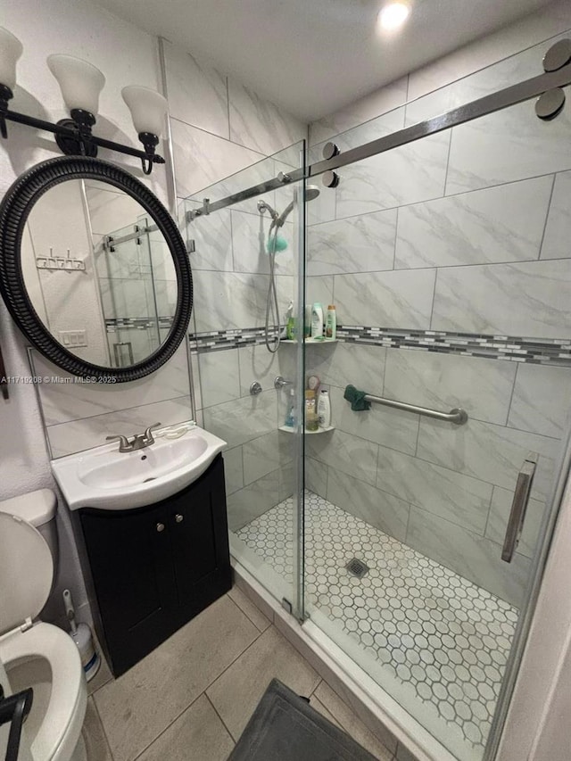 full bathroom with toilet, a stall shower, backsplash, and vanity