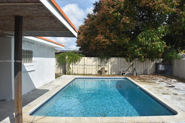 view of swimming pool featuring a fenced backyard and a fenced in pool