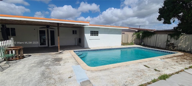 view of pool featuring a patio area, a fenced backyard, a ceiling fan, and a fenced in pool