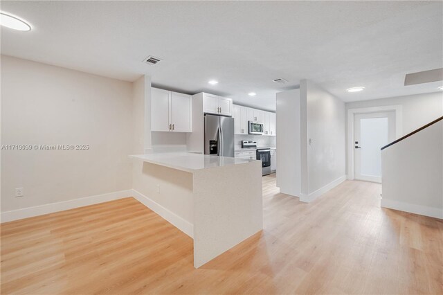 unfurnished room featuring light hardwood / wood-style flooring