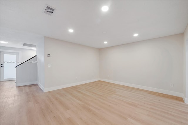 unfurnished room with light wood-type flooring