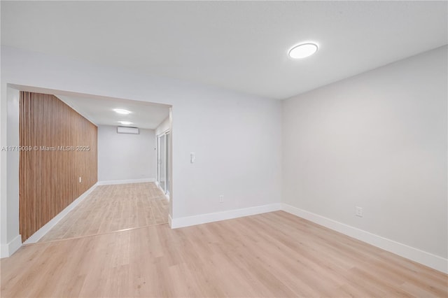 unfurnished room with light hardwood / wood-style flooring