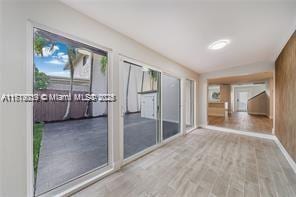 entryway with light hardwood / wood-style floors