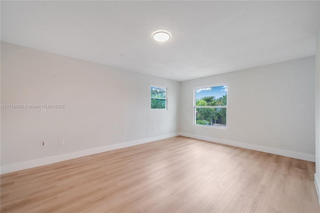 unfurnished room featuring light wood-type flooring