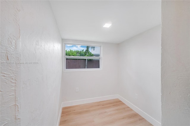 spare room featuring light hardwood / wood-style flooring