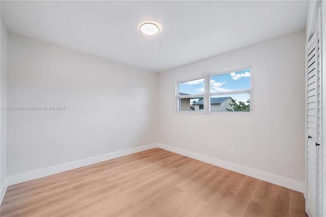 spare room featuring light hardwood / wood-style floors