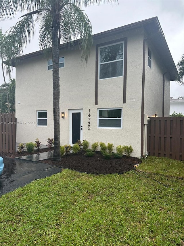 view of front of home with a front yard