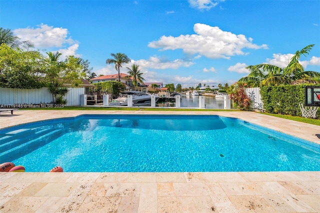 view of pool featuring a water view