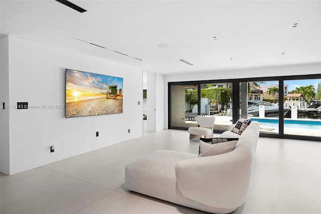 living room featuring concrete floors