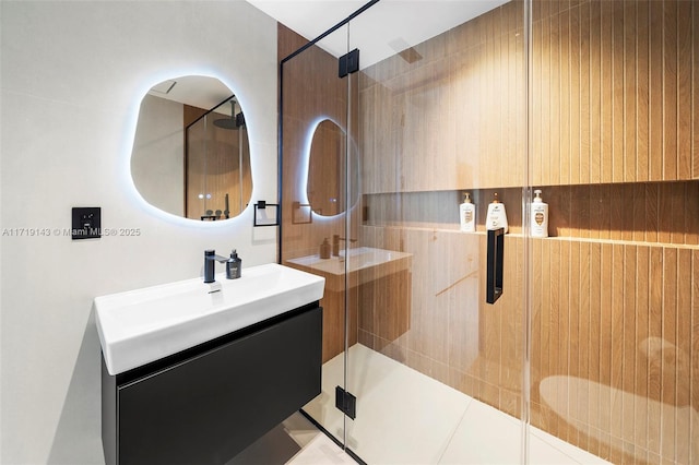 bathroom with vanity, tile patterned floors, and a shower with shower door