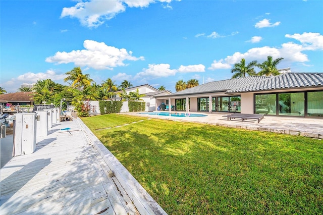 exterior space with a fenced in pool