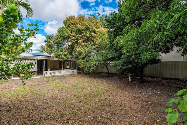 view of yard with a sunroom