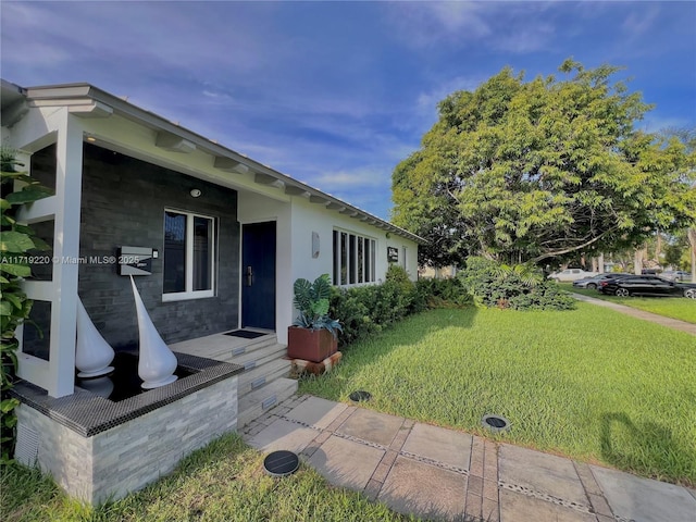 view of front of home with a front yard