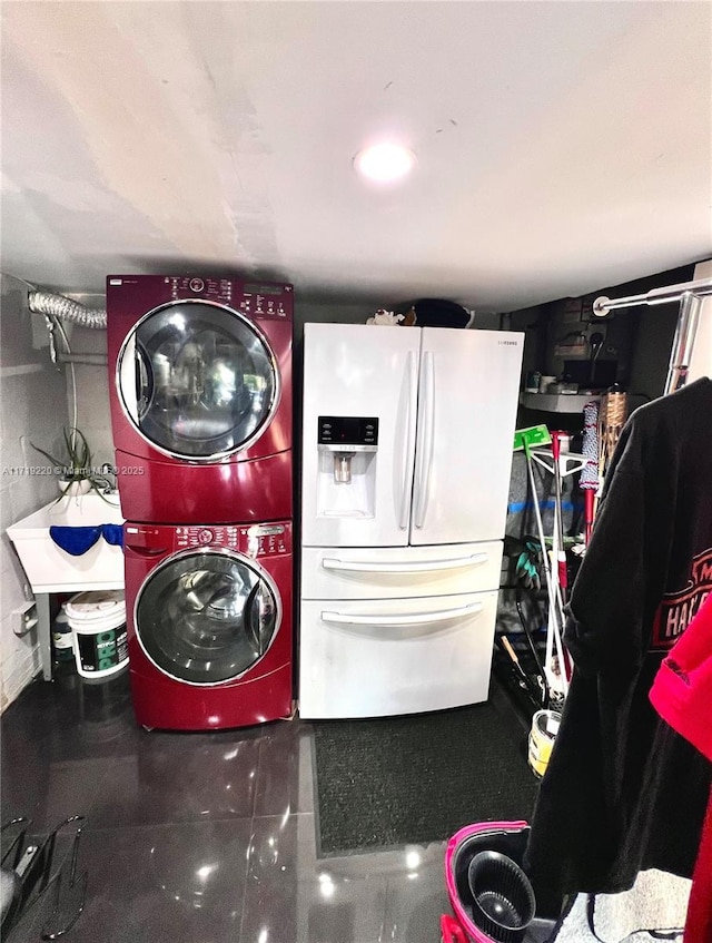 washroom with stacked washer / drying machine