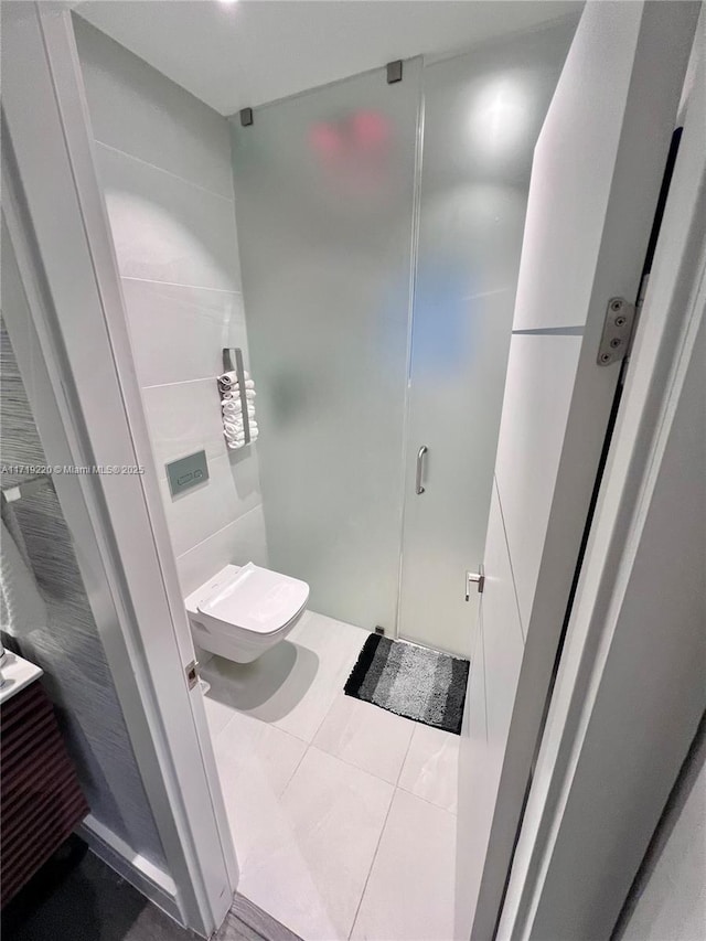 bathroom featuring tile patterned flooring and toilet