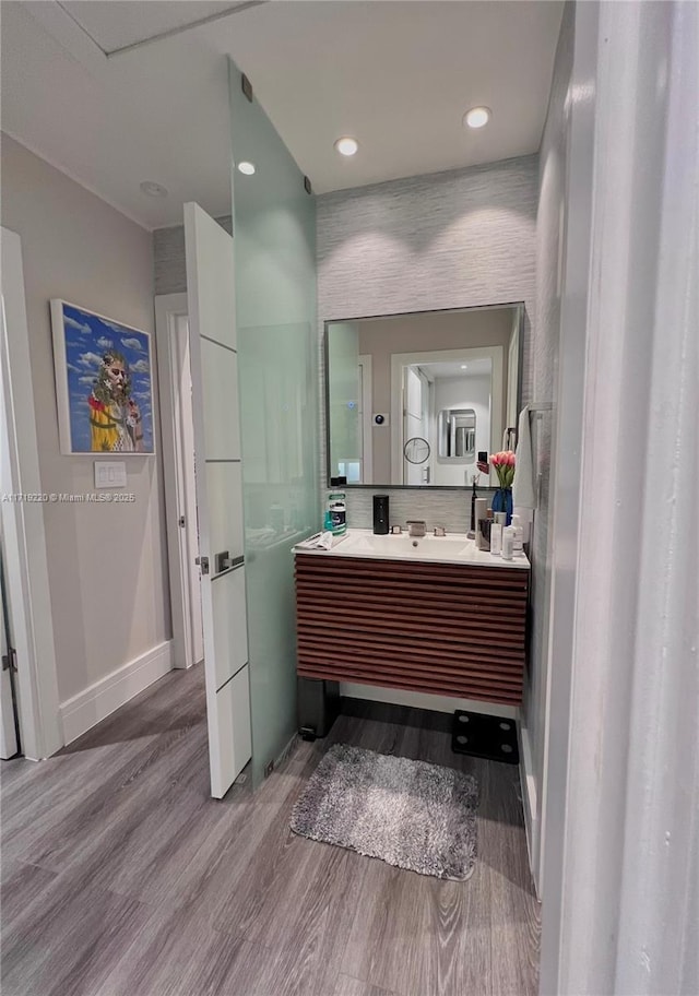 bathroom featuring hardwood / wood-style flooring and vanity