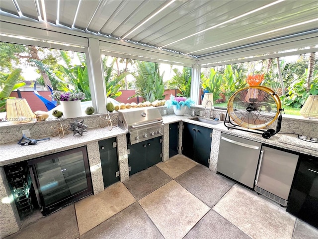 view of patio with wine cooler, area for grilling, grilling area, and sink