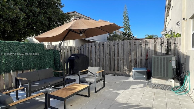 view of patio with grilling area, outdoor lounge area, and central AC unit