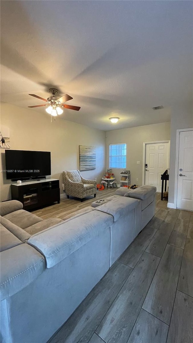 living room featuring ceiling fan