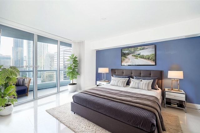 tiled bedroom with access to exterior and expansive windows