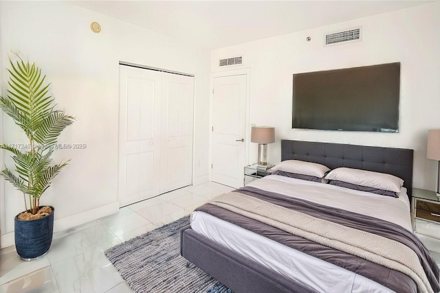 495 Brickell Ave Unit 2301, Miami, FL 33131 - bedroom with a closet and baseboards