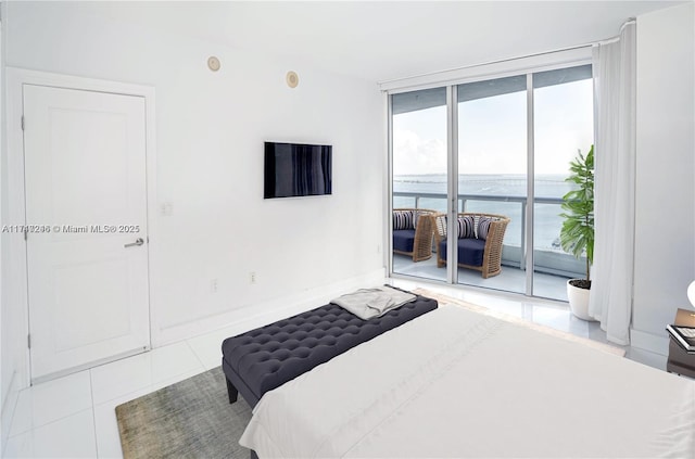 tiled bedroom with expansive windows and access to outside