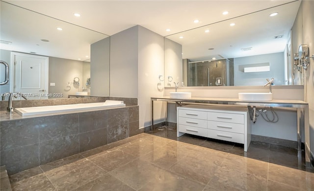 495 Brickell Ave Unit 2301, Miami, FL 33131 - bathroom featuring recessed lighting, a shower stall, a bath, and vanity