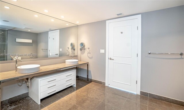 495 Brickell Ave Unit 2301, Miami, FL 33131 - full bathroom with recessed lighting, baseboards, double vanity, and tile patterned flooring