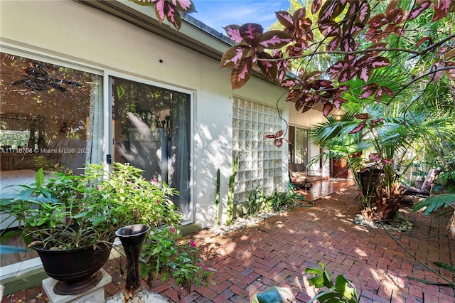 view of property exterior with a patio area