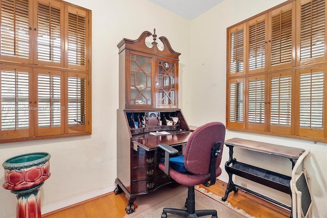 office area featuring french doors, hardwood / wood-style flooring, and a wealth of natural light