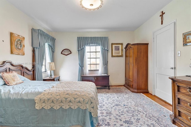 bedroom with light wood-type flooring