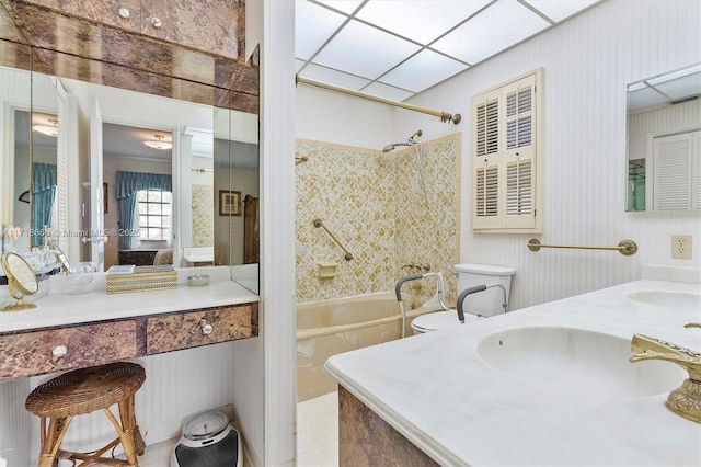 full bathroom with bathing tub / shower combination, vanity, and toilet