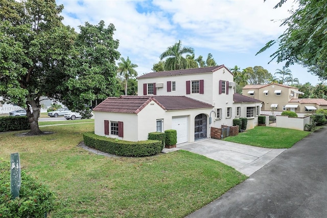 mediterranean / spanish home featuring a garage and a front lawn