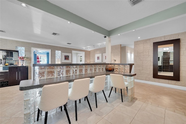 bar featuring light tile patterned flooring