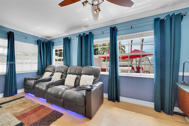 living room with ceiling fan, light hardwood / wood-style floors, and ornamental molding