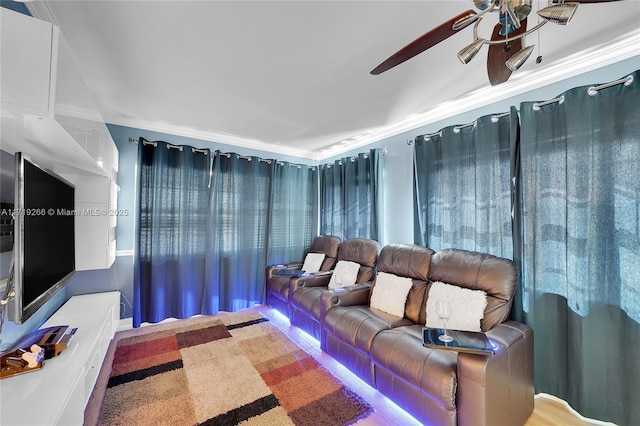 interior space with ceiling fan and crown molding