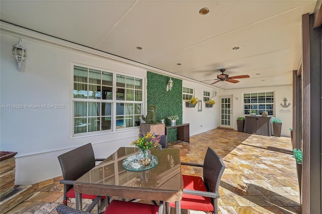 view of patio featuring ceiling fan