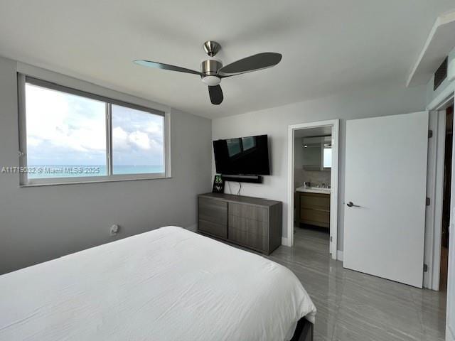 bedroom with ceiling fan and ensuite bathroom