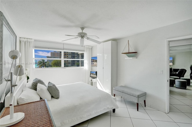 bedroom featuring ceiling fan and light tile patterned floors