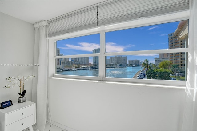 interior space with a view of city and a water view