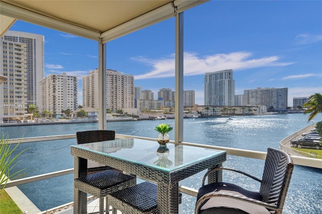 balcony with a view of city and a water view