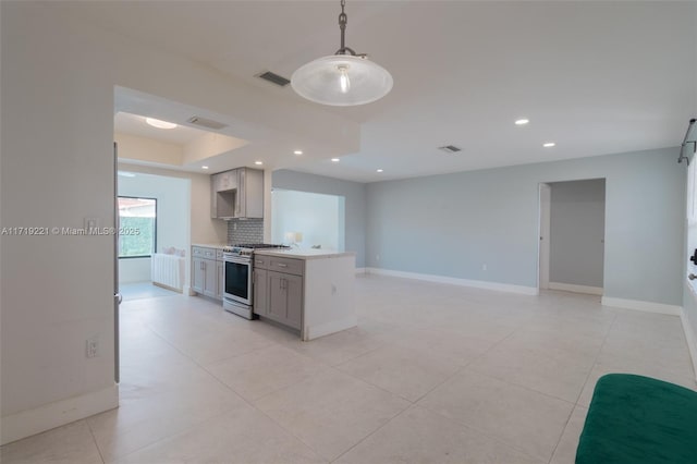 kitchen featuring recessed lighting, gray cabinetry, visible vents, decorative backsplash, and stainless steel range with gas stovetop