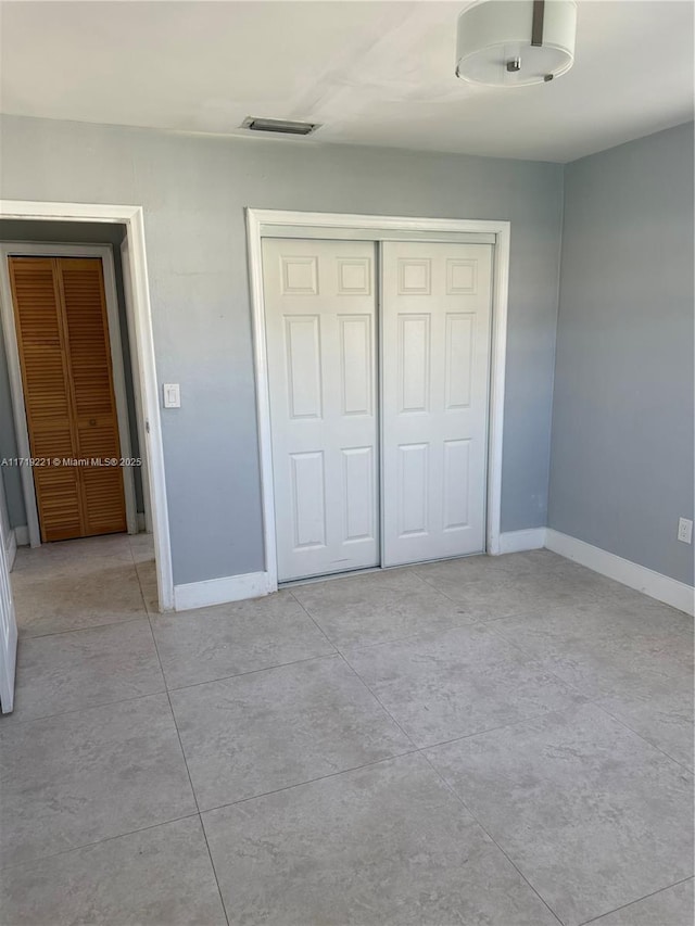 unfurnished bedroom with a closet