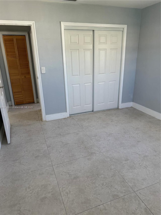 unfurnished bedroom featuring a closet