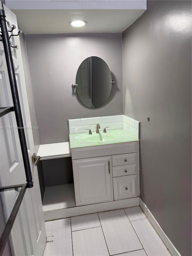 bathroom with tile patterned floors and vanity