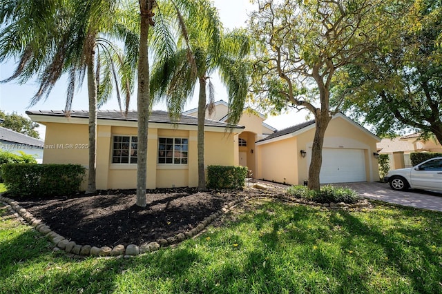 ranch-style home with a front yard and a garage