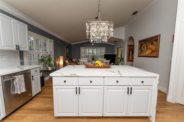 13080 NW 8th Ct, Sunrise, FL 33325 - kitchen with stainless steel dishwasher, light wood-style floors, plenty of natural light, crown molding, and vaulted ceiling