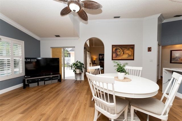13080 NW 8th Ct, Sunrise, FL 33325 - dining area featuring a ceiling fan, crown molding, light wood-style flooring, and plenty of natural light